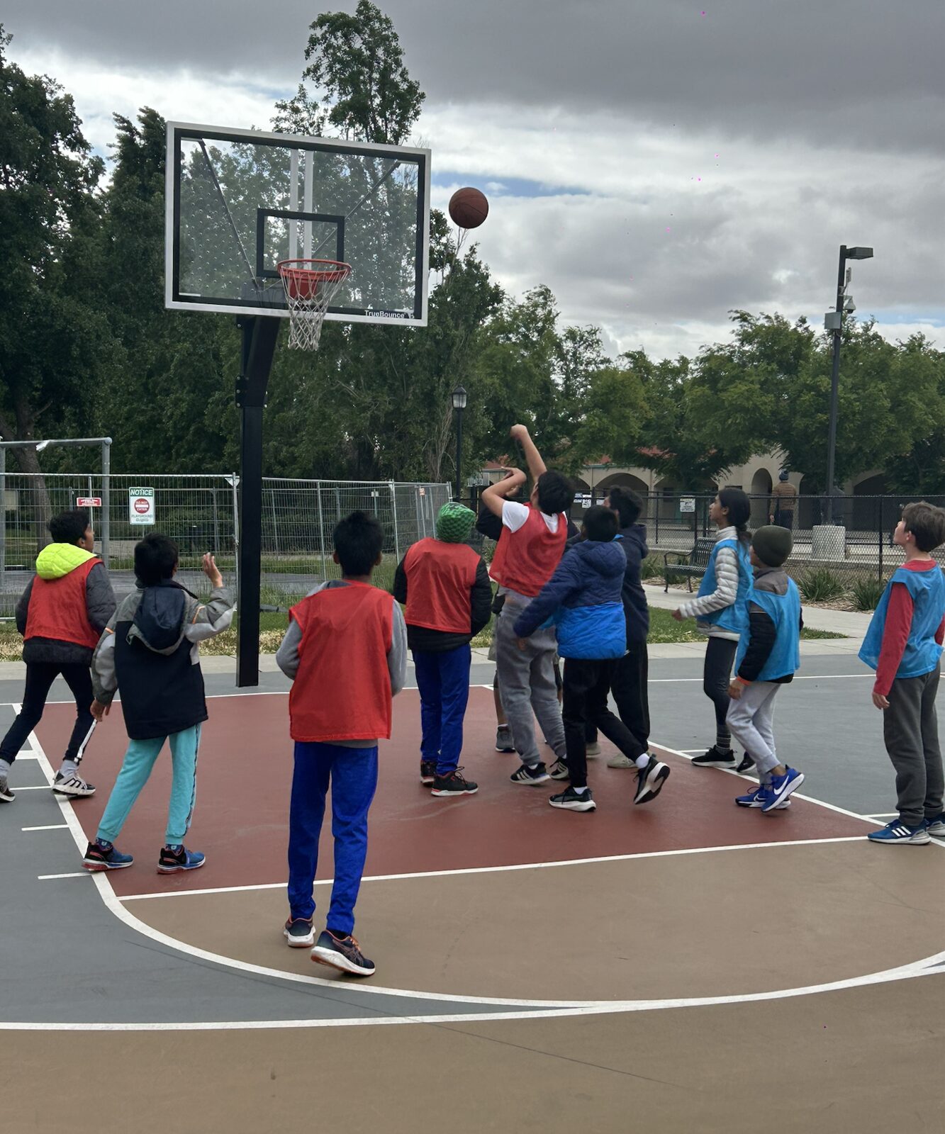 Two players jumping for a contested rebound